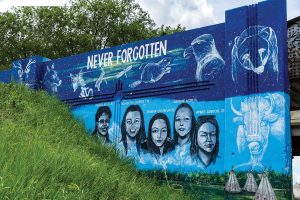MURAL ARTIST TOM ANDRICH’S PUBLIC ART IN HONOUR OF MMIW, LOCATED ON THE PORTAGE AVE. AND EMPRESS ST. OVERPASS IN WINNIPEG. // PHOTO BY UM TODAY