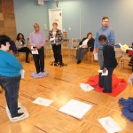 Staff at the office of General Synod take part in the Blanket Exercise, a teaching tool in Indigenous Canadian history, at the Chapel of the Holy Apostles February 17.  Photo: Tali Folkins
