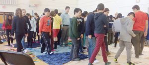 Pictured: Students and teachers in the UTS gym during the Blanket Exercise.
