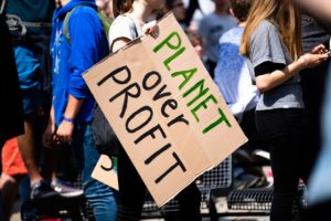 planet over profit sign at rally