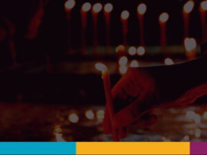 lighting candles at memorial